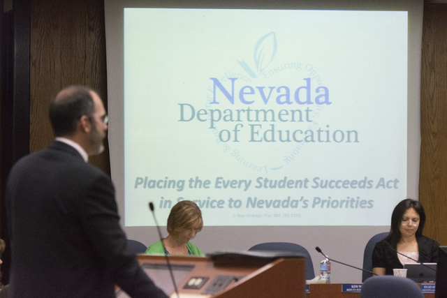 Superintendent of Public Instruction for the Nevada Department of Education Steve Canavero, left, speaks to Clark County School District Trustees about the Every Student Succeeds Act at the Greer ...
