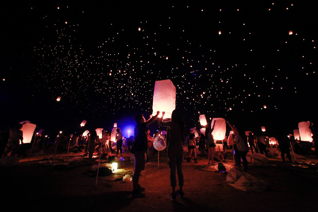Lanterns are released into the sky at Rise Lantern Festival at the Moapa River Indian Reservation on Saturday, Oct. 10, 2015. Chase Stevens/Las Vegas Review-Journal Follow @csstevensphoto