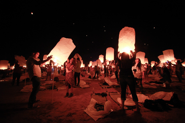 Attendees prepare to release their lanterns at Rise Lantern Festival at the Moapa River Indian Reservation on Saturday, Oct. 10, 2015. Chase Stevens/Las Vegas Review-Journal Follow @csstevensphoto
