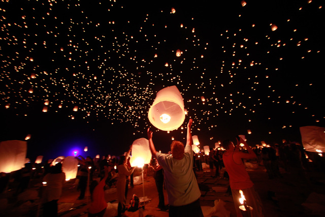 Attendees release lanterns into the sky at Rise Lantern Festival at the Moapa River Indian Reservation on Saturday, Oct. 10, 2015. Chase Stevens/Las Vegas Review-Journal Follow @csstevensphoto