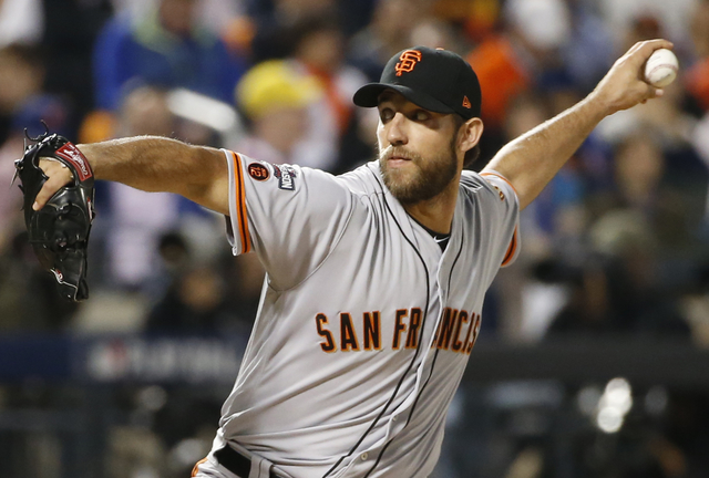 San Francisco Giants starting pitcher Madison Bumgarner (40) winds up during the first inning of a National League wild-card baseball game against the New York Mets on Wednesday, Oct. 5, 2016, in  ...