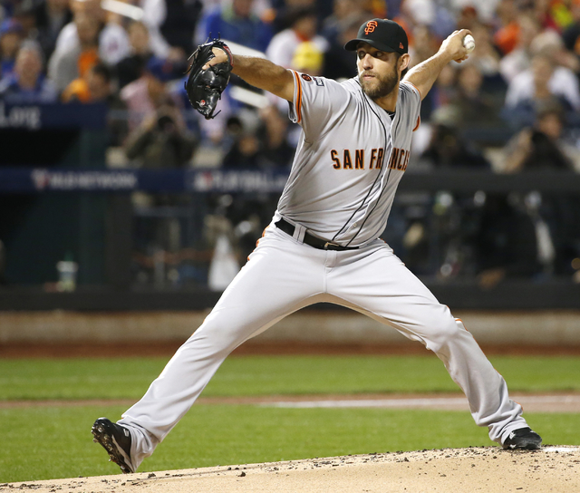 San Francisco Giants starting pitcher Madison Bumgarner (40) winds up during the first inning of a National League wild-card baseball game against the New York Mets. Wednesday, Oct. 5, 2016, in Ne ...