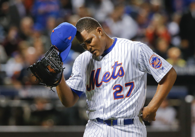 New York Mets relief pitcher Jeurys Familia (27) walks off the field at the end of the top of the ninth inning after giving up a three-run home run to San Francisco Giants' Conor Gillaspie during  ...