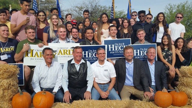 Mitt Romney, Rep. Cresent Hardy, Rep. Joe Heck, Sen. Dean Heller and Nevada Lt. Gov. Mark Hutchison pose for photos with campaign volunteers at a campaign rally in Las Vegas on Saturday, Oct. 8, 2 ...
