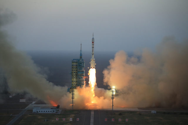 In this photo provided by China's Xinhua News Agency, the Long March-2F carrier rocket carrying China's Shenzhou 11 spacecraft blasts off from the launch pad at the Jiuquan Satellite Launch Center ...