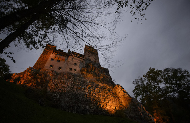 Bran Castle lies on top of cliffs in Bran, Romania. Airbnb has launched a contest to find two people to stay overnight in the castle on Halloween.  (Andreea Alexandru/AP)
