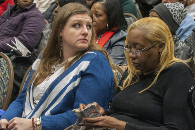 Flint residents Melissa Mays, left, and Rhonda Kelso sit during a news conference in Flint, Mich. (John M. Galloway/AP)