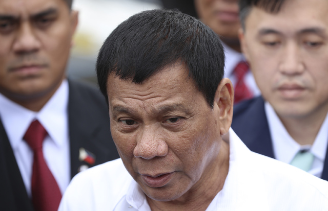 Philippine President Rodrigo Duterte speaks to journalists after a coast guard training demonstration at a Japan Coast Guard base in Yokohama, Thursday, Oct. 27, 2016. Duterte is on a three-day of ...