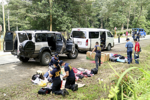 Police inspect the contents of the vehicles following an operation Friday, Oct. 28, 2016 at Makilala township, North Cotabato province in southern Philippines. Philippine police say Mayor Samsudin ...