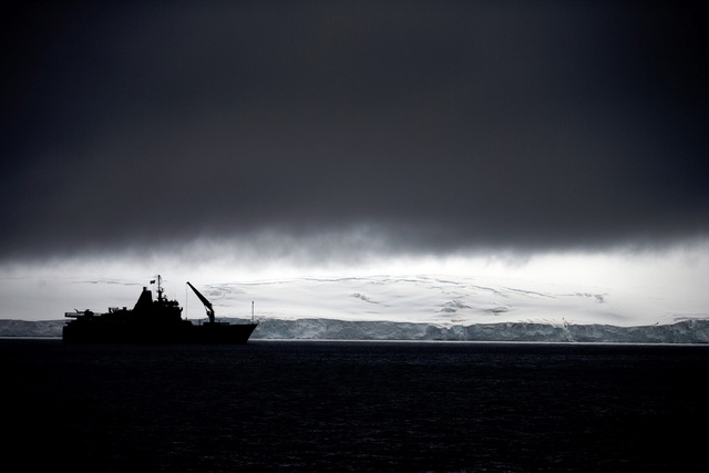 In this Jan. 25, 2015 photo, Chile's Navy ship Aquiles moves alongside the Hurd Peninsula, seen from Livingston Islands, in Antarctica. The countries that decide the fate of Antarctica agreed on F ...