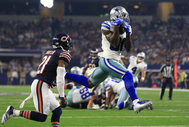 In this Sept. 25, 2016, file photo, Chicago Bears cornerback Tracy Porter (21) defends as Dallas Cowboys wide receiver Dez Bryant (88) catches a pass thrown by Dak Prescott (4) for a touchdown in  ...