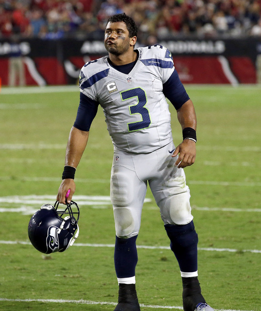 In this Oct. 23, 2016, file photo, Seattle Seahawks quarterback Russell Wilson (3) reacts after a missed game-winning field goal attempt during overtime of an NFL football game against the Arizona ...