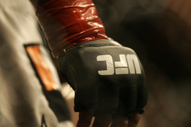 Closeup of a glove and the UFC logo at Ultimate Fighting Championship 73 on Saturday, July 7, 2007, in Sacramento, Calif. (Jeff Chiu/AP)