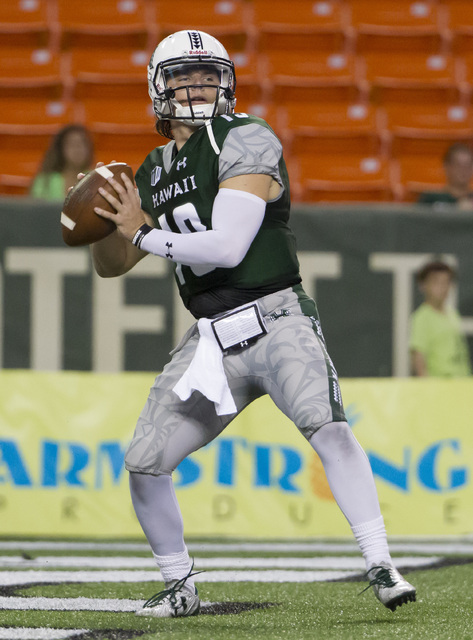 Hawaii quarterback Dru Brown drops back to pass during the first quarter of an NCAA college football game against UNLV, Saturday, Oct. 15, 2016, in Honolulu. (Eugene Tanner/AP)