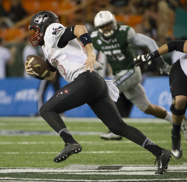 UNLV quarterback Dalton Sneed (18) scrambles out of the backfield during the first quarter of an NCAA college football game against Hawaii, Saturday, Oct. 15, 2016, in Honolulu. (Eugene Tanner/AP)