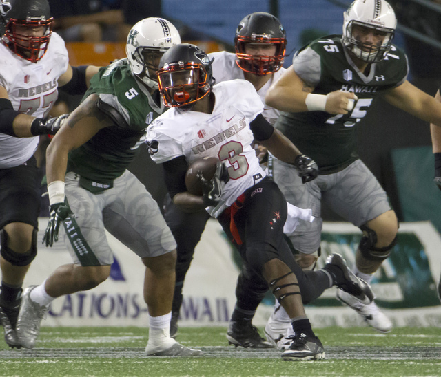UNLV running back Lexington Thomas (3) runs with the football during the second quarter of an NCAA college football game against Hawaii, Saturday, Oct. 15, 2016, in Honolulu. (Eugene Tanner/AP)