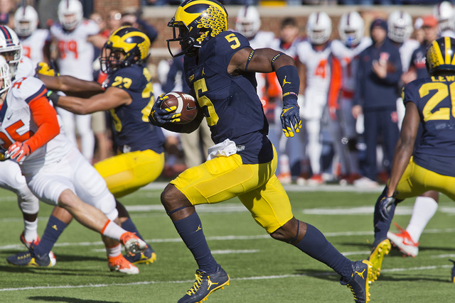 Michigan linebacker Jabrill Peppers (5) returns a kickoff in the first quarter of an NCAA college football game against Illinois at Michigan Stadium in Ann Arbor, Mich., Saturday, Oct. 22, 2016. M ...