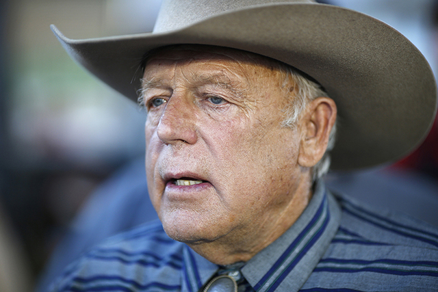 In this April 11, 2015, file photo, Nevada rancher Cliven Bundy speaks with supporters at an event in Bunkerville, Nev.  (AP Photo/John Locher, File)