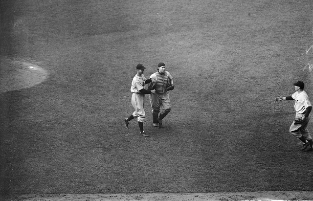 Detroit Tigers' Hal Newhouser, left, winning pitcher and Catcher Bob Swift, right, who relieved injured Paul Richard, walk off the field after their team won the World Series at Wrigley Field, Chi ...