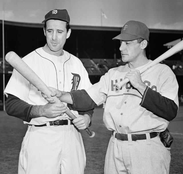 Detroit Tigers left fielder Hank Greenberg, left, and Chicago Cubs first baseman Phil Cavarretta whose powerful bats were a decisive factor in squaring off the first and second World Series game h ...