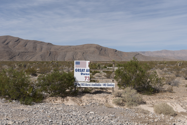 Beaten-up signage sits in front of the approximately 180 acres of land purchased by Scott Gragson and partners at the Apex Industrial Park near U.S. 93 and Interstate 15 in North Las Vegas, Wednes ...