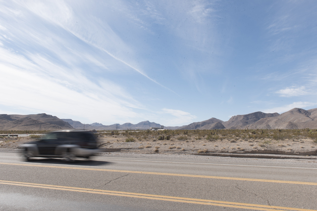 A car passes by the approximately 180 acres of land purchased by Scott Gragson and partners at the Apex Industrial Park near U.S. 93 and Interstate 15 in North Las Vegas is seen, Wednesday, Oct. 1 ...