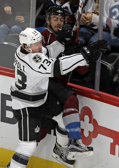 Colorado Avalanche defenseman Duncan Siemens, right, is checked into the boards by Los Angeles Kings forward Tyler Toffoli (73) during the first period of a preseason NHL hockey game, Friday, Sept ...
