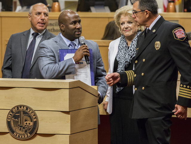 Las Vegas City Councilman Ricki Barlow, left, recognizes award recipients for fire safety week at a meeting of the Las Vegas City Council on Wednesday, Oct. 05, 2016, in Las Vegas. The FBI recentl ...