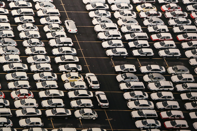 Photographer Edward Burtynsky's overhead view of cars and more cars at a Houston car lot -- "VW Lot #1" -- is part of "Oil," more than 50 images shot around the world, now on display at UNLV's Mar ...