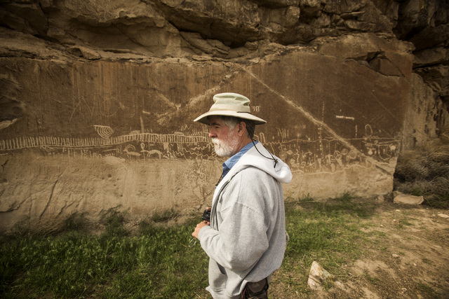 Ecologist and outdoorsman Jim Boone views rock art during a May 2015 tour of what is now part of Basin and Range National Monument. (Jeff Scheid/Las Vegas Review-Journal Follow @jlscheid)