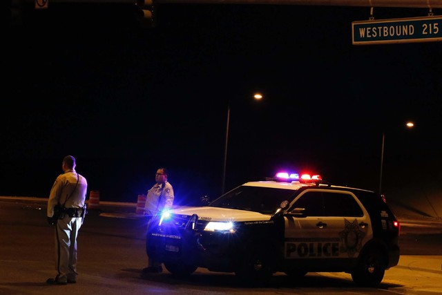 Metro cars block the westbound ramp to the 215 Beltway as police investigate a fatal officer-involved shooting in northwest Las Vegas, Thursday, Oct. 13, 2016. (Chitose Suzuki/LasVegas Review-Journal)