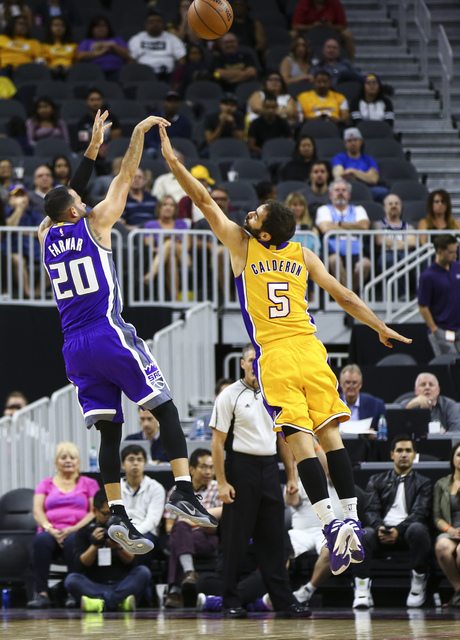 Sacramento Kings guard Jordan Farmar (20) goes up for a shot over Los Angeles Lakers guard Jose Calderon (5) during a preseason basketball game at the T-Mobile Arena in Las Vegas on Thursday, Oct. ...