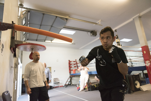 Nonito Donaire, right, trains at Bones Adams Boxing Gym in Las Vegas on Monday, Oct. 17, 2016, to defend his Super Bantamweight title against Jessie Magdaleno at a Nov. 5 fight at the Thomas & ...