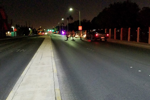 Metropolitan Police officers are on the scene of a fatal hit-and-run on Bruce Street between Owens and Searles avenues. (Mike Shoro/Las Vegas Review-Journal)