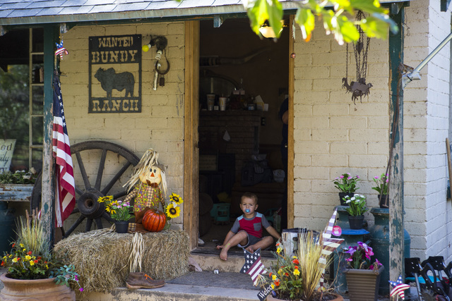 A grandson of Cliven Bundy sits in a doorway at Bundy Ranch in Bunkerville on Friday, Oct. 28, 2016. Members of an armed group that staged a takeover of the Malheur National Wildlife Refuge near B ...