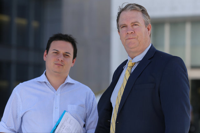Attorney Bret Whipple, right, and law clerk Mike Mee pose for a photo outside the Lloyd George U.S. Courthouse in Las Vegas on Thursday, Oct. 13, 2016. Cliven Bundy is seeking to hire Whipple as h ...