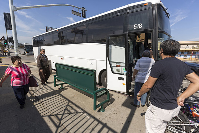Casino-bound travelers board a tour bus in Los Angeles recently. (Damian Dovarganes/The Associated Press)