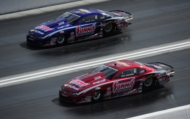 NHRA Mello Yello Series Pro Stock drivers Greg Anderson (red) and Jason Line race each other during qualifying for the Toyota NHRA Nationals at The Strip at Las Vegas Motor Speedway in Las Vegas F ...