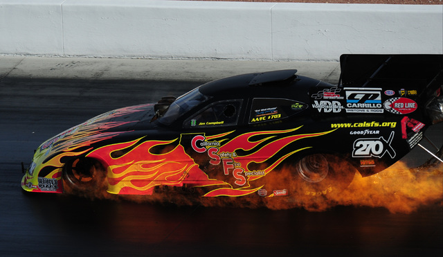 The Funny Car driven by Jim Campbell catches fire during the third qualifying session for the NHRA Mello Yello Series Toyota Nationals at The Strip at Las Vegas Motor Speedway in Las Vegas Saturda ...