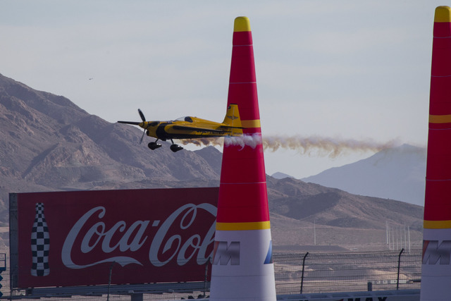 Pilot Nigel Lamb of Great Britain flies his MXS-R aircraft through race pylons on the final day of the Red Bull Air Race World Championship at the Las Vegas Motor Speedway, Sunday, Oct. 16, 2016.  ...