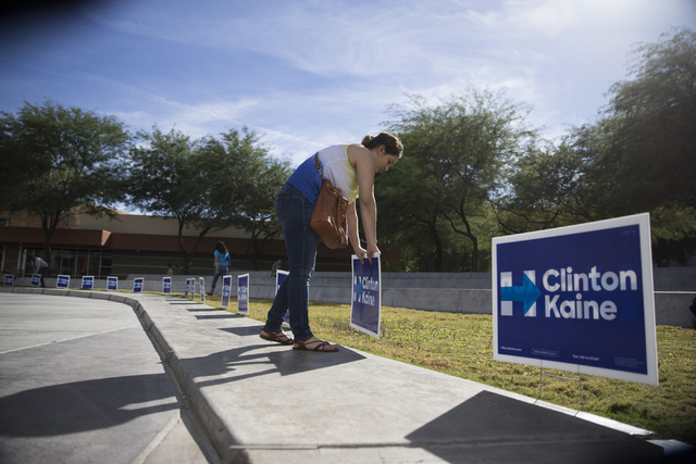 Volunteer Shelsy Robaina, 15, puts up signs for a campaign rally for Democratic presidential nominee Hillary Clinton at UNLV on Saturday, Oct. 22, 2016, in Las Vegas. Erik Verduzco/Las Vegas Revie ...