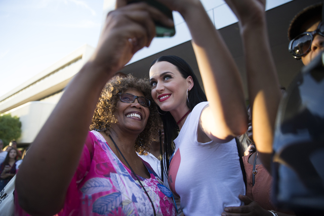 Music artist Katy Perry, left, poses with Liz Richmond of Las Vegas after speaking during a campaign rally for Democratic presidential nominee Hillary Clinton at UNLV on Saturday, Oct. 22, 2016, i ...