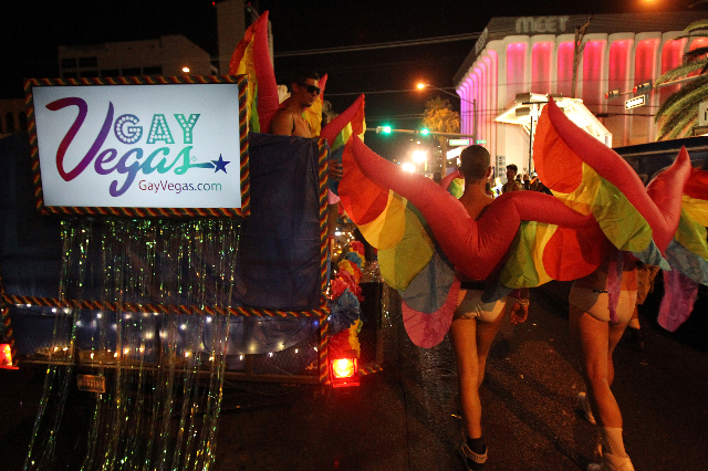 Members of the GayVegas.com entry march in the 16th Annual Las Vegas PRIDE Night Parade in downtown Las Vegas Friday, Sept. 5, 2014. The event supports the lesbian, gay, bisexual and transgender c ...