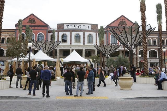Invitees gather to attend the ribbon-cutting for the opening of Tivoli Village's second phase Friday, Oct. 28, 2016, in Las Vegas. The second phase added more than 270,000 square feet of retail, r ...