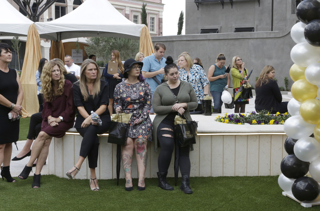 Invitees gather to attend the ribbon-cutting for the opening of Tivoli Village's second phase Friday, Oct. 28, 2016, in Las Vegas. The second phase added more than 270,000 square feet of retail, r ...