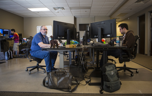 Architect Yo Sub Kwon, from left, Senior Engineer Adam Englander and Android Developer Armando Smith, work at their desks at LaunchKey, a Las Vegas-based technology company that was recently acqui ...