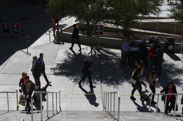 People walk outside of the Thomas & Mack Center ahead of the third presidential debate at UNLV in Las Vegas on Wednesday, Oct. 19, 2016. Chase Stevens/Las Vegas Review-Journal Follow @cssteven ...