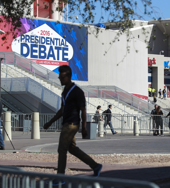 A man walks outside of the Thomas & Mack Center ahead of the third presidential debate at UNLV in Las Vegas on Wednesday, Oct. 19, 2016. Chase Stevens/Las Vegas Review-Journal Follow @cssteven ...