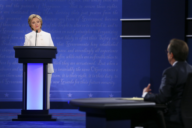 Democratic presidential candidate Hillary Clinton, left, responds to a question from moderator Chris Wallace of Fox News during the third presidential debate at the Thomas & Mack Center at UNL ...