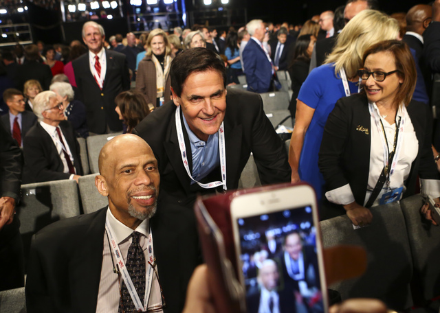 Former NBA star Kareem Abdul-Jabbar, left, poses for a photo with businessman Mark Cuban before the third presidential debate begins at the Thomas & Mack Center at UNLV in Las Vegas on Wednesd ...